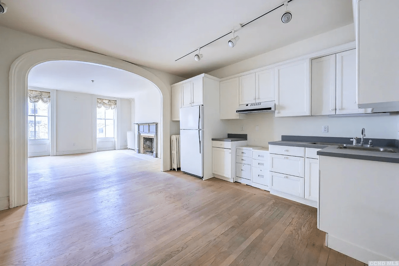 kitchen with white cabinets and appliances