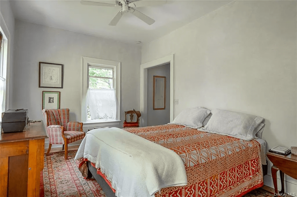 bedroom with ceiling fan and two exposures