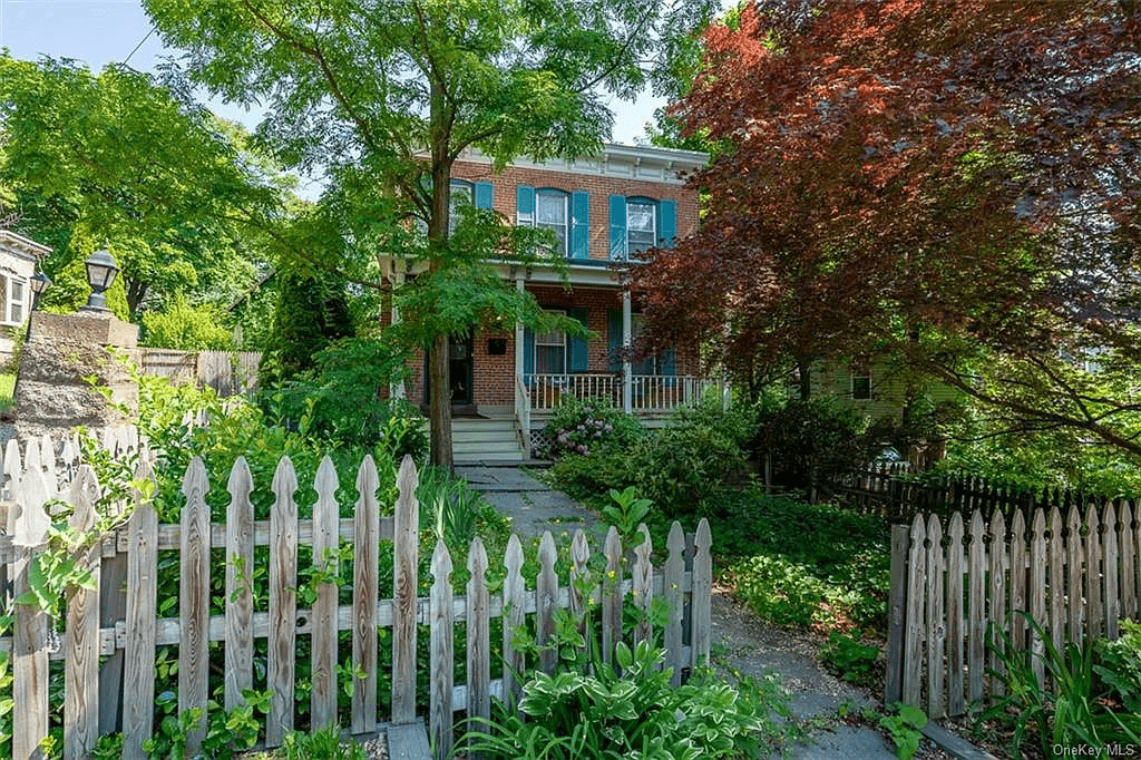 picket fence enclosing the front garden of the house