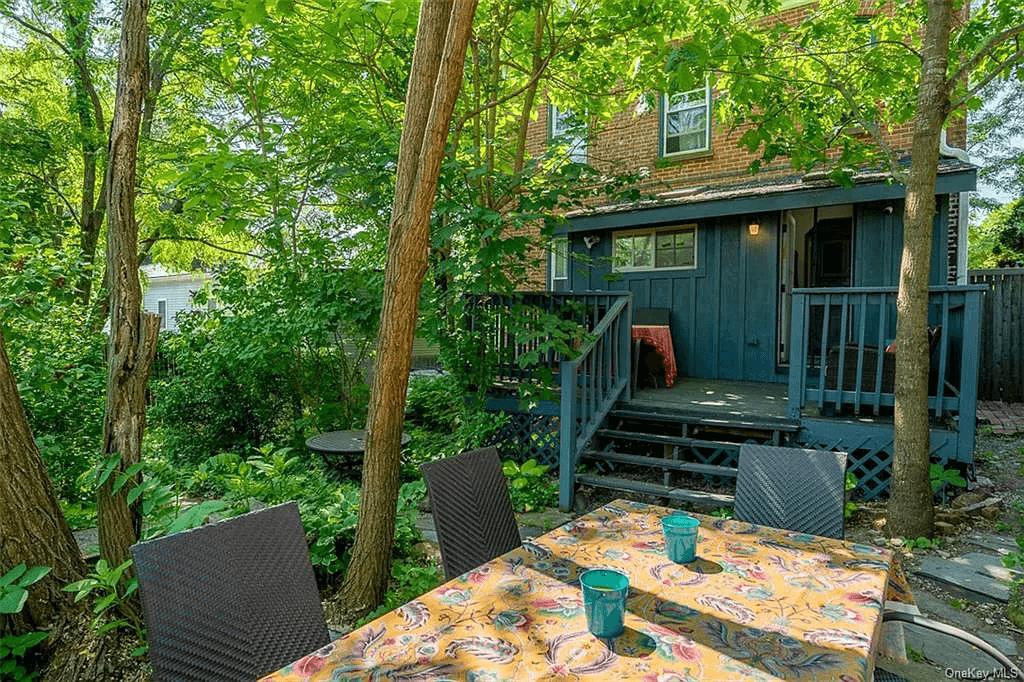 blue painted wood deck on rear of house