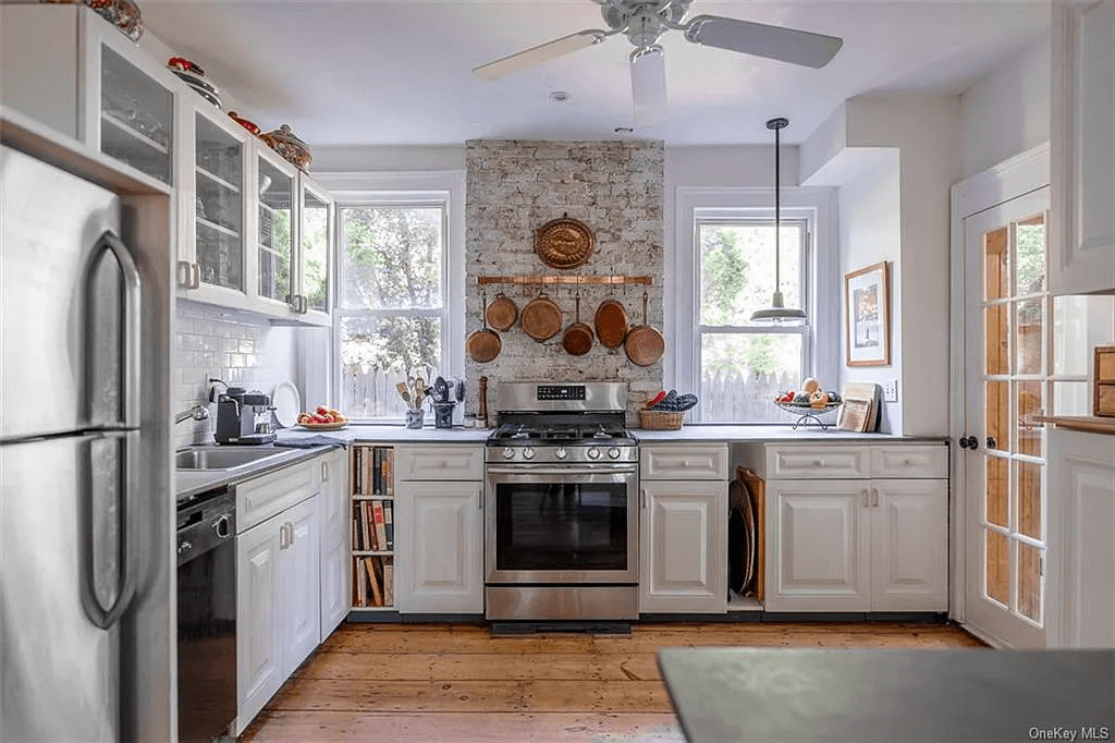 kitchen with white cabinets and ceiling fan