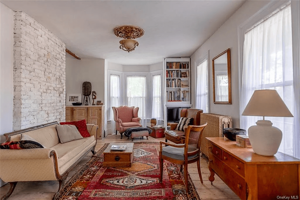 living room with exposed brick chimney wall