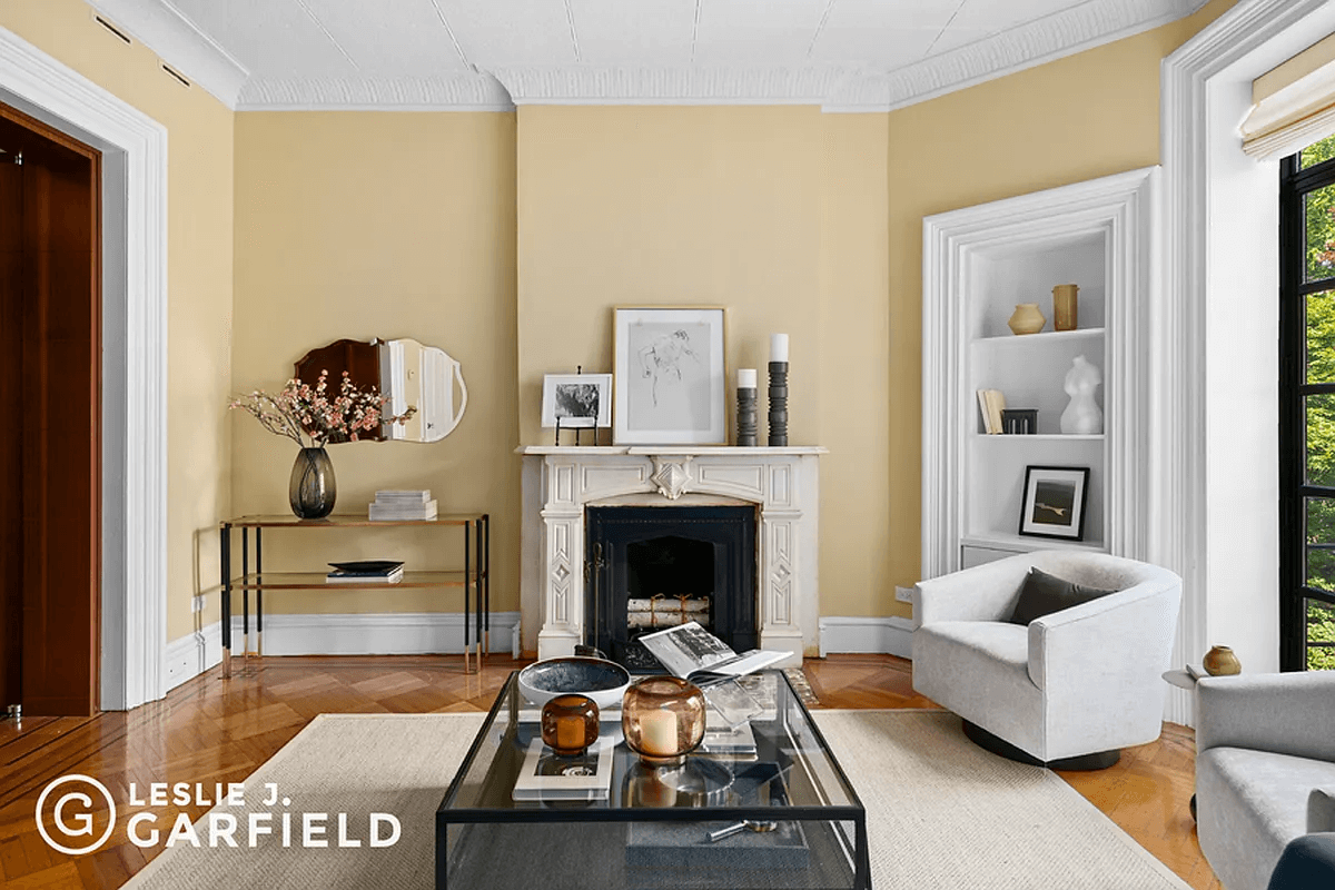 rear parlor with marble mantel and tin ceiling