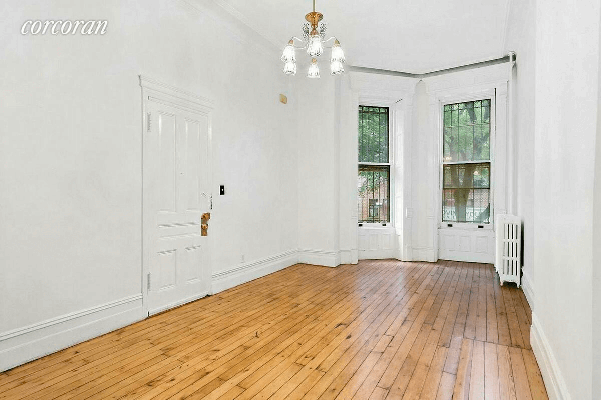 living room with two windows and a wood floor