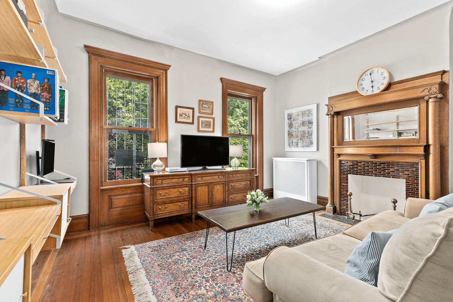 bedroom with a columned mantel set up as a den