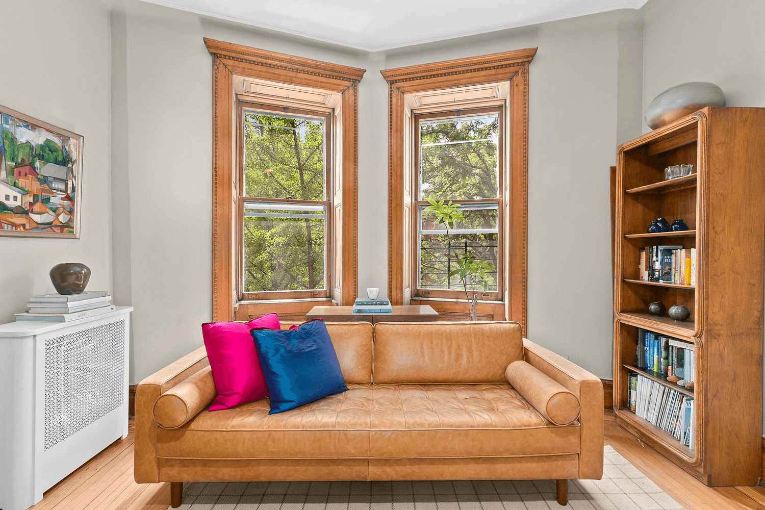 two windows with wood moldings in living room