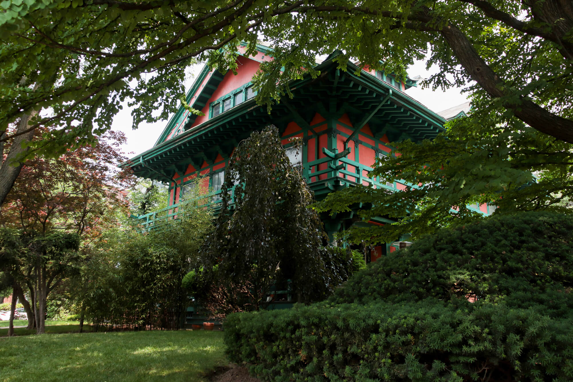 the exterior of the house known as the Japanese house enveloped by greenery