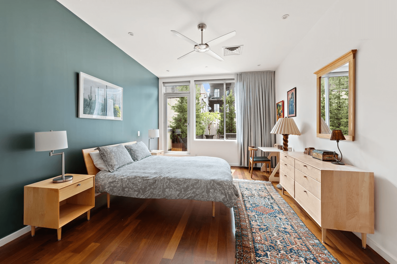 bedroom with a ceiling fan and a glass door to terrace