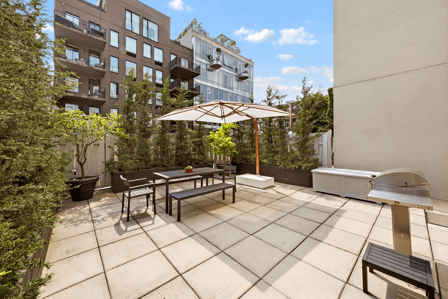 terrace with planters and room for dining