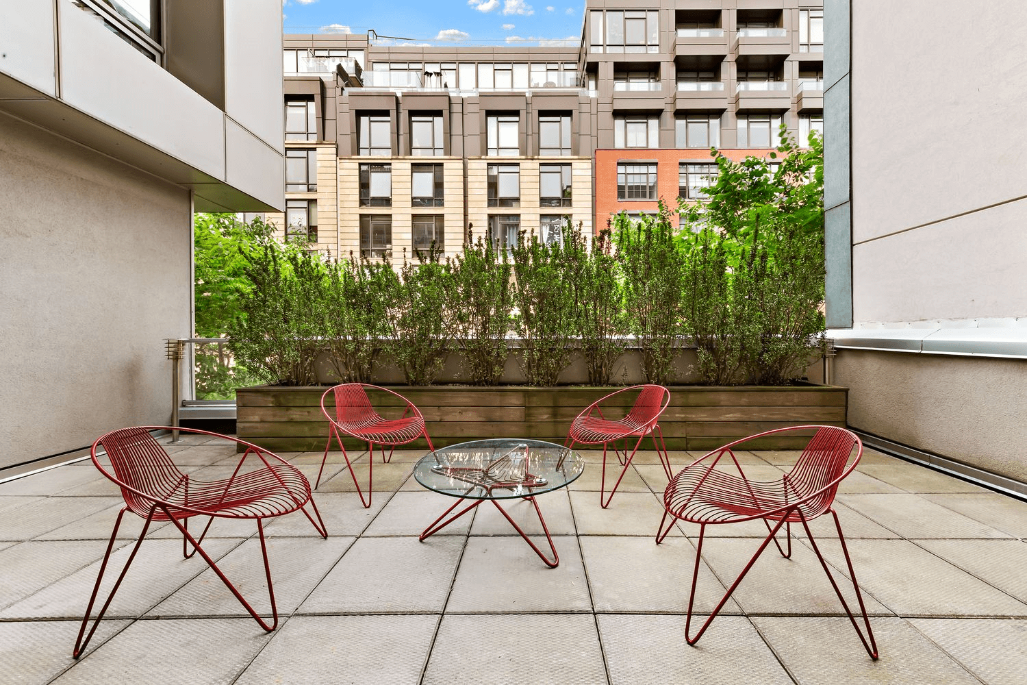 smaller terrace with a planter box and seating