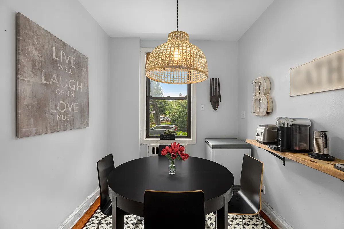 dining nook with window and wood floor