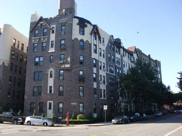 the tudor style brick exterior of the corner building