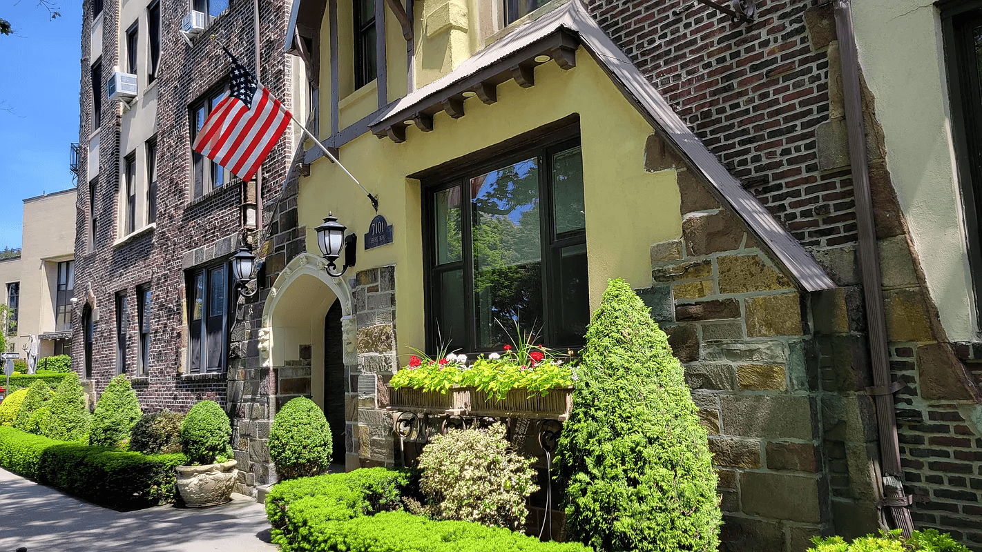 entrance of the building with arched entry, stonework and dark brick