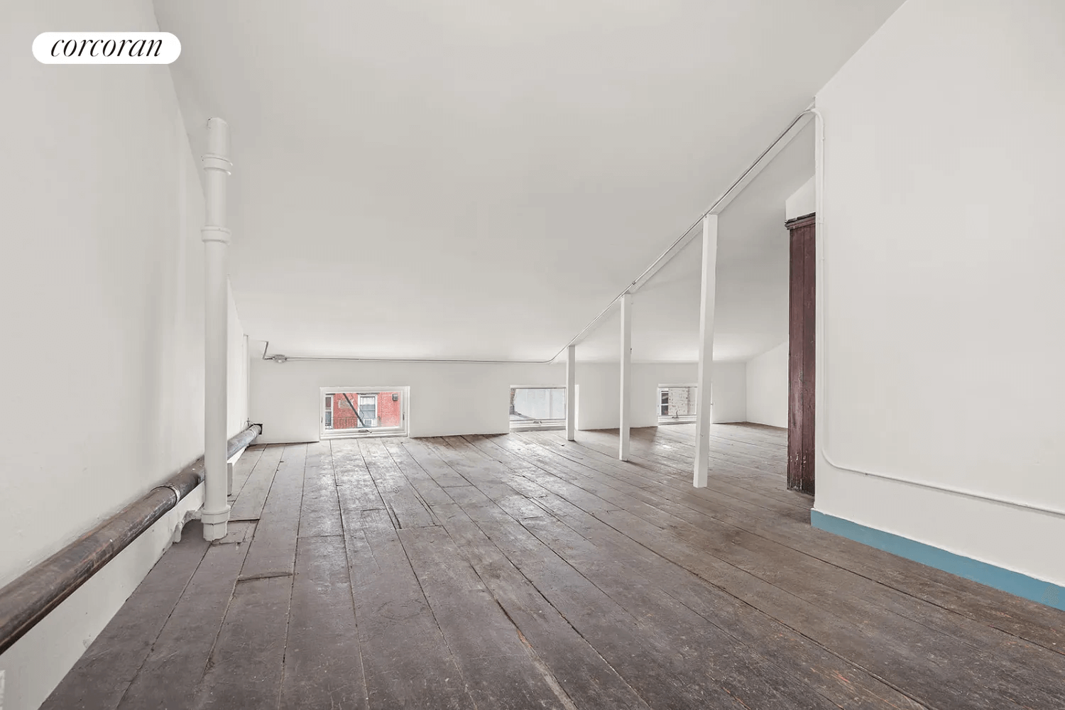 attic with wood floors