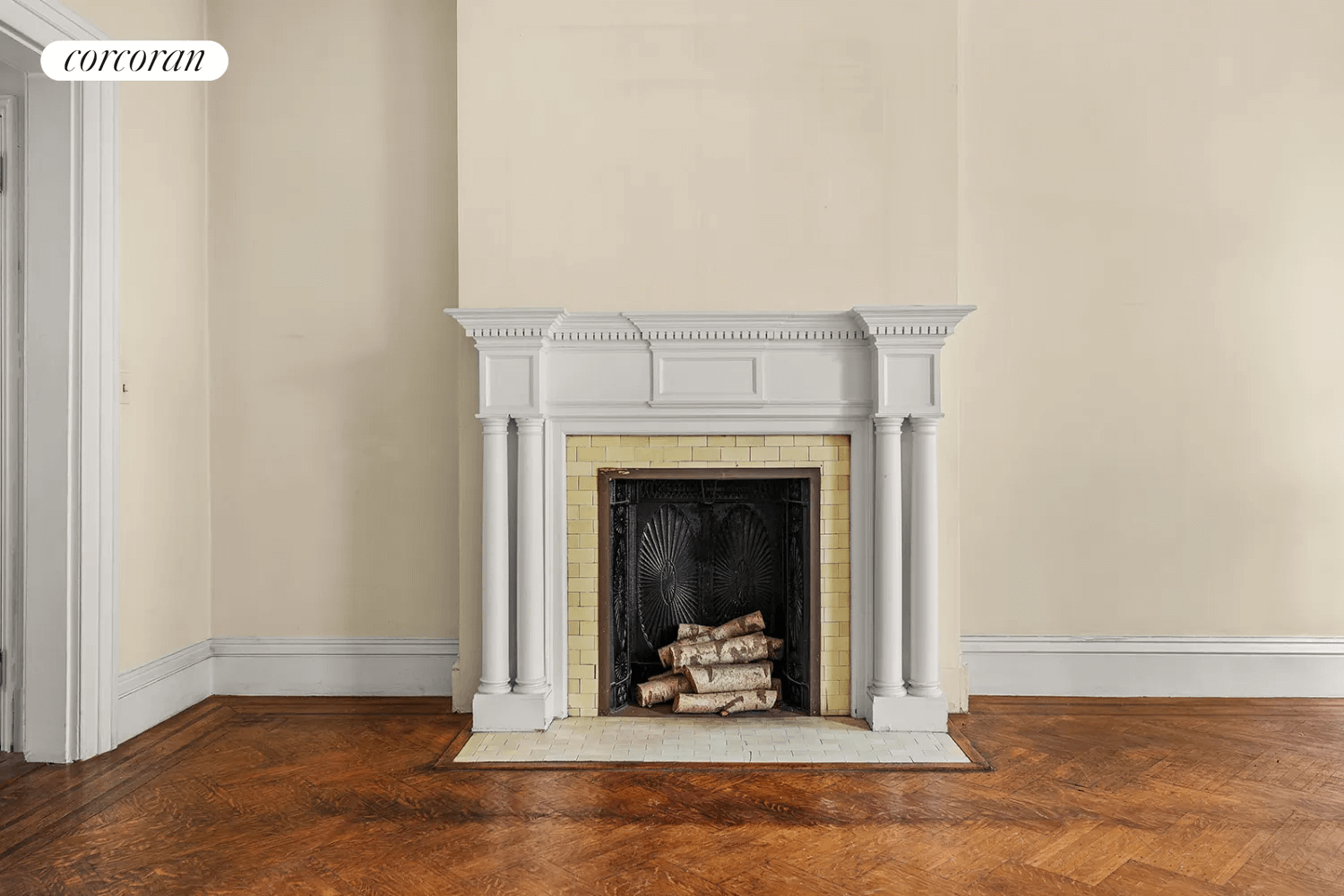 mantel with dentil molding and a yellow tile surround