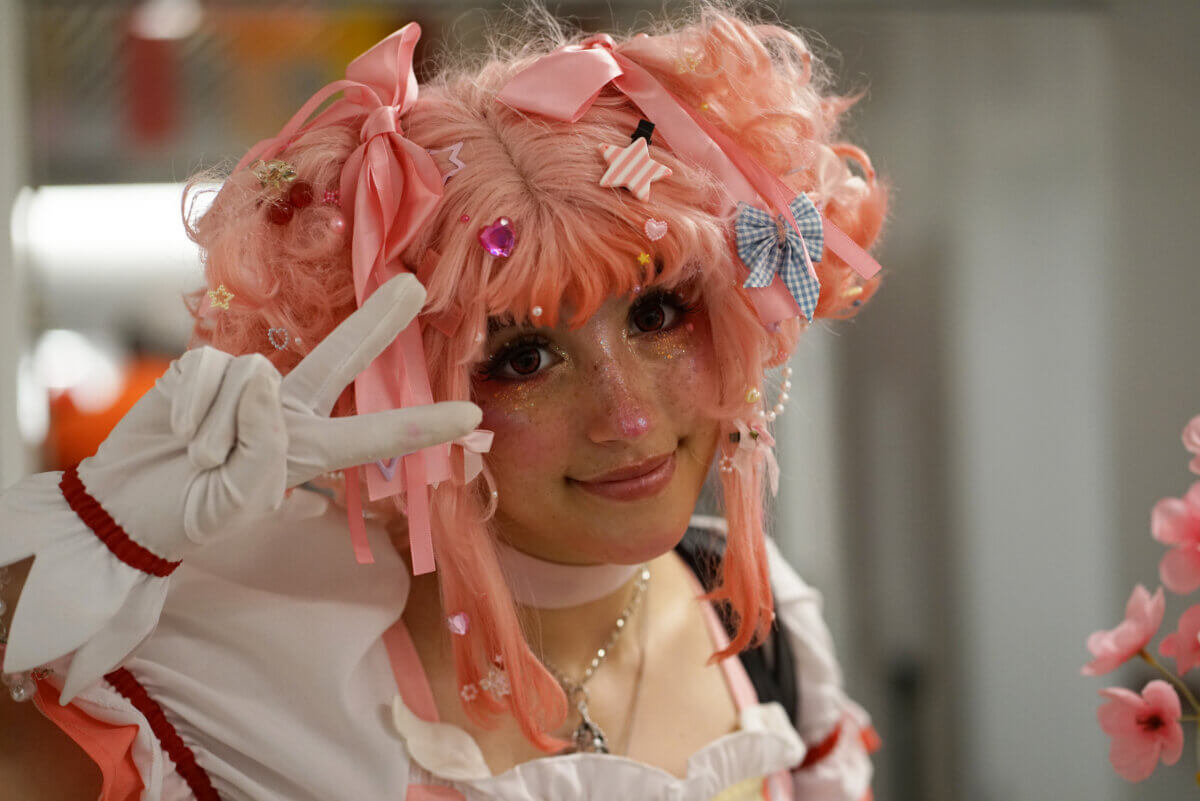 dressed up with a bright pink wig