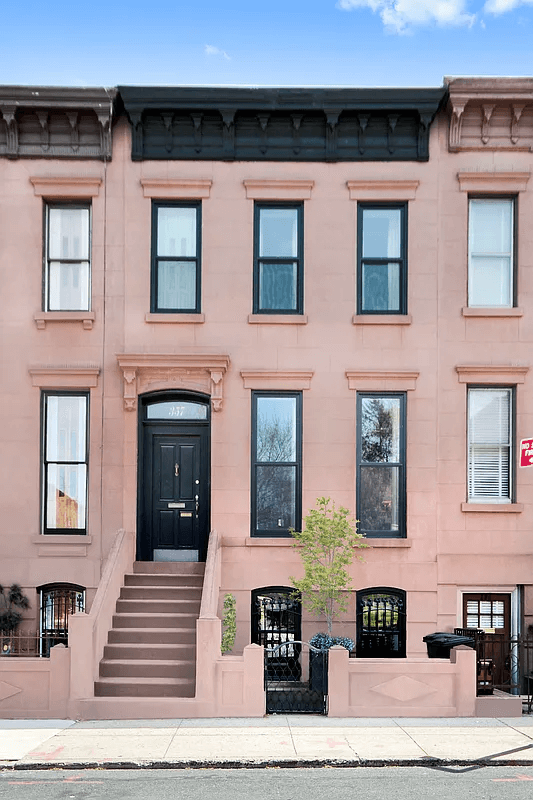 exterior of brownstone with stoop and bracketed cornice