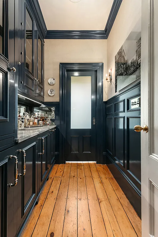 wet bar with blue cabinets