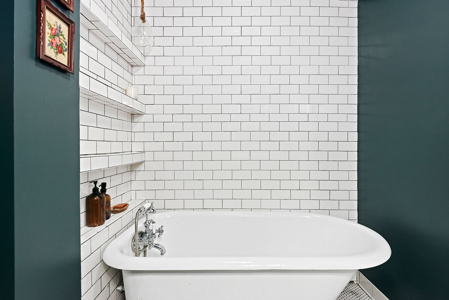 bathroom with tub and white subway tile