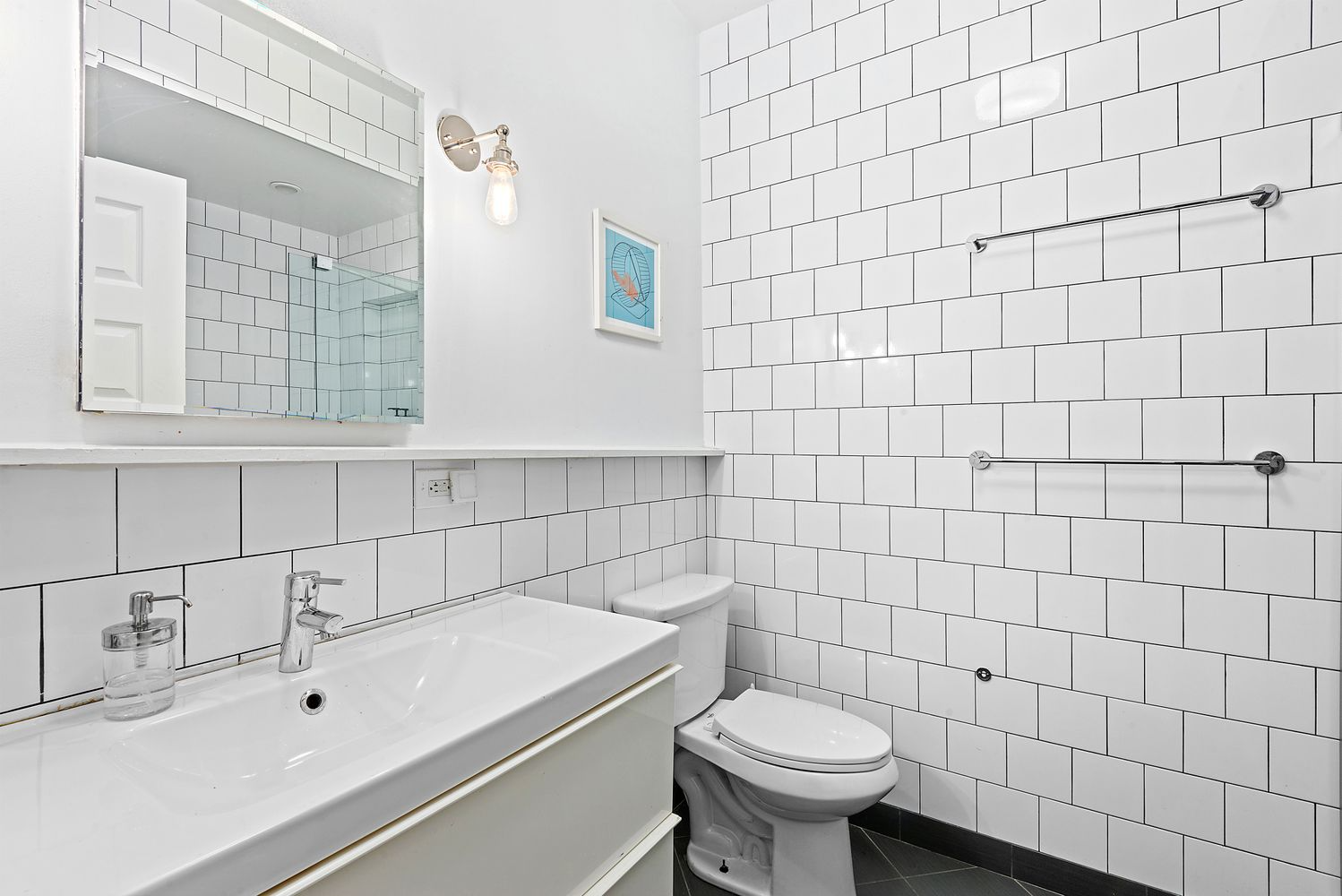 bathroom with white fixtures and tile