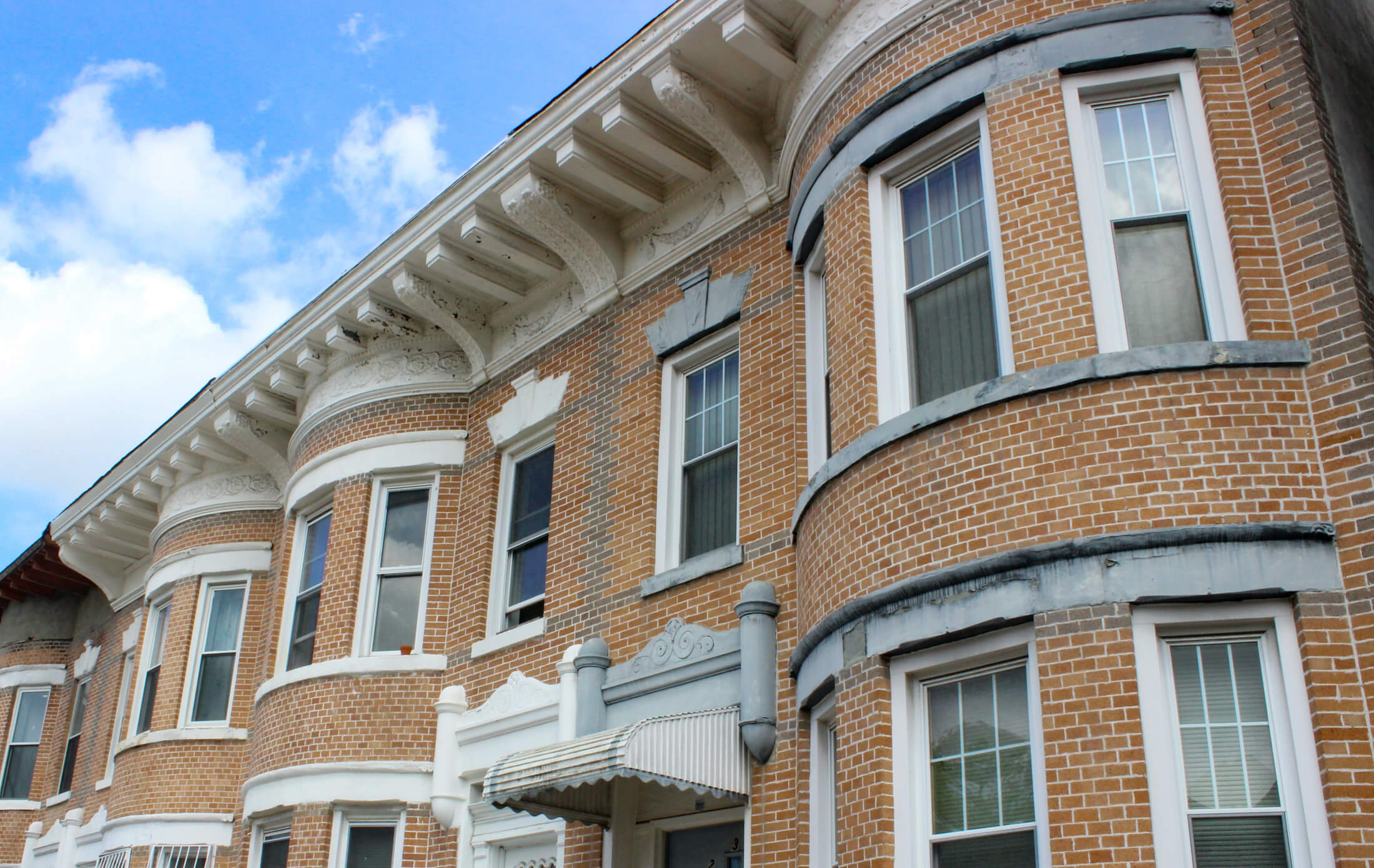 brick row hosues with a deep cornice