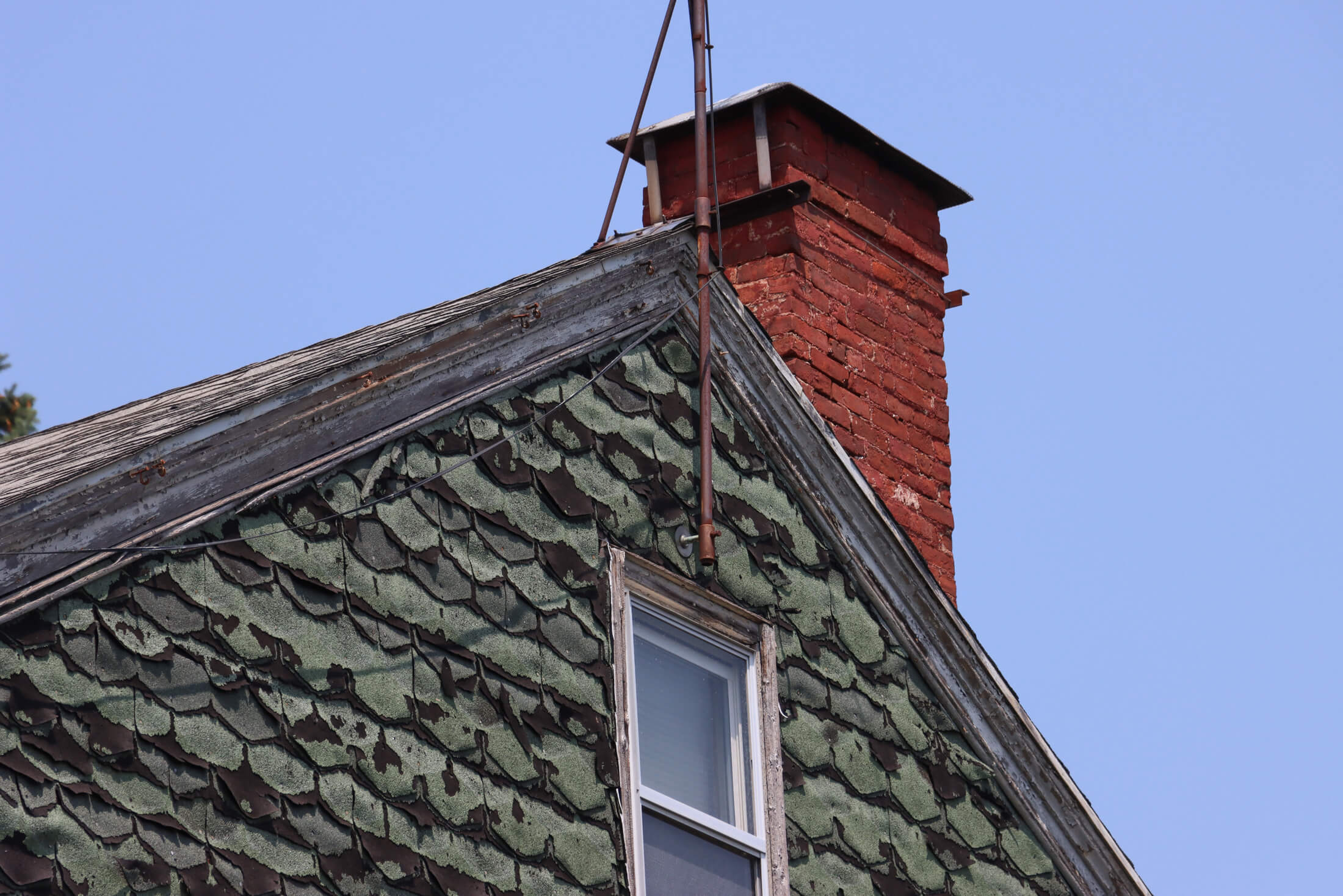 the side gable and a brick chimney