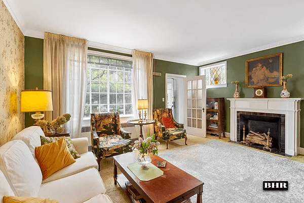 living room with carpeting and a fireplace