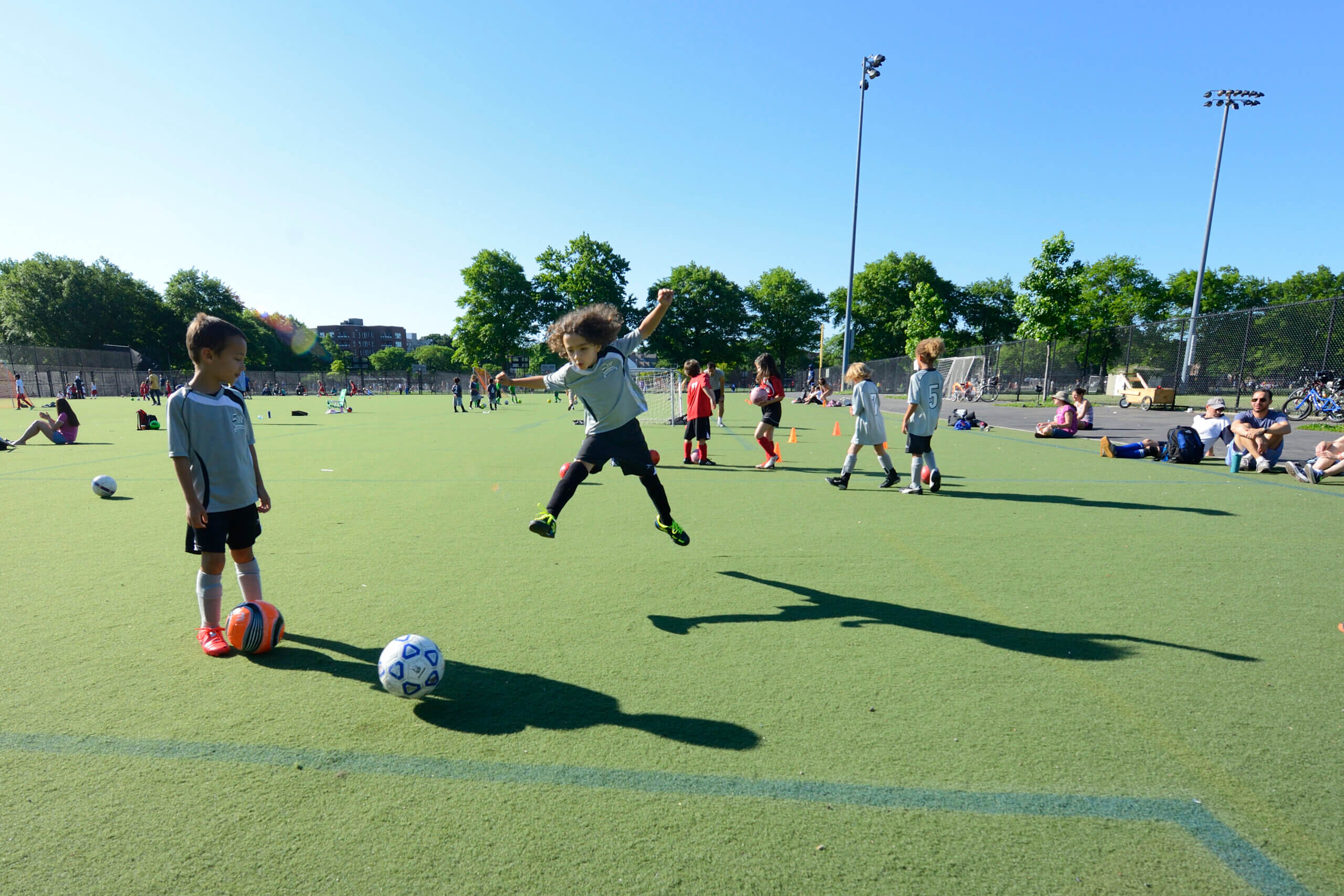 children playing soccer on the parade ground