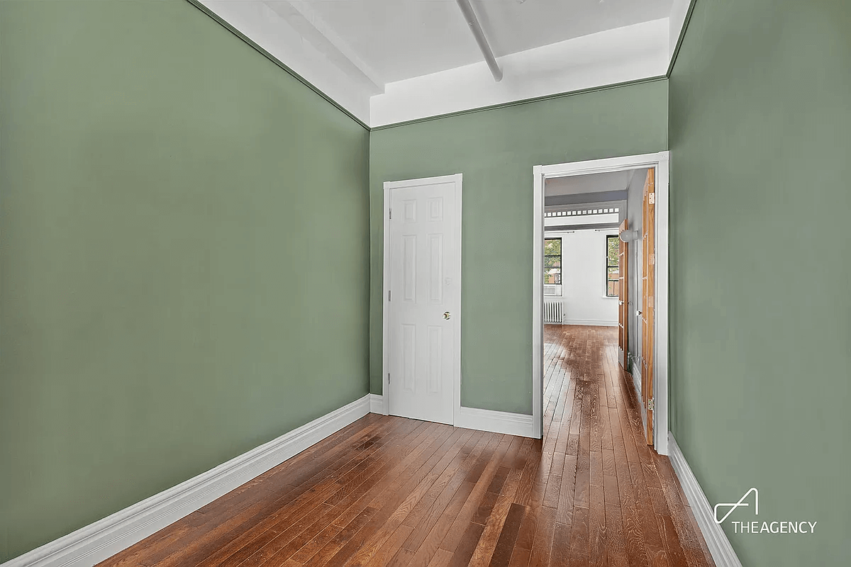 windowless room with green walls