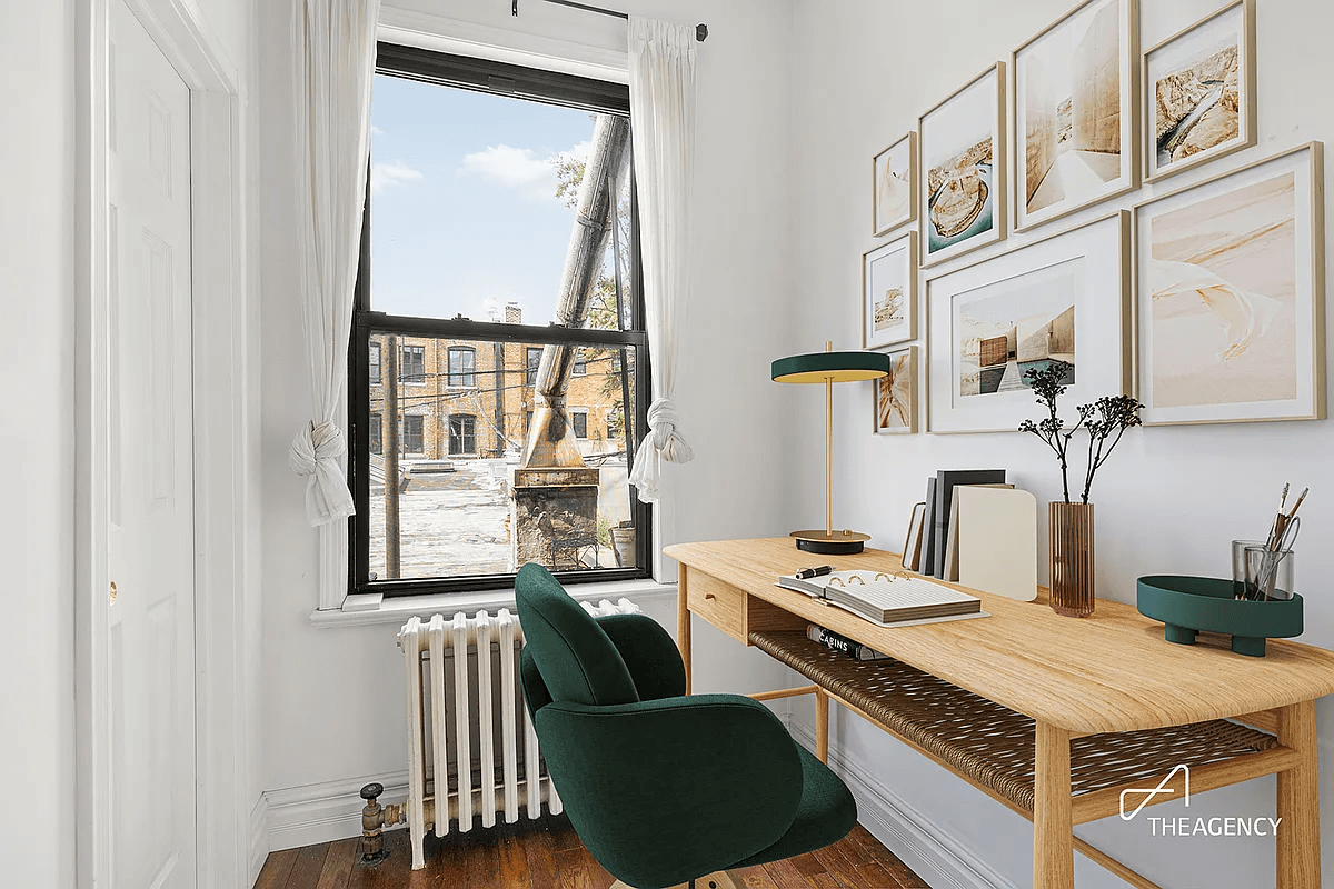 staged view of office nook with a window