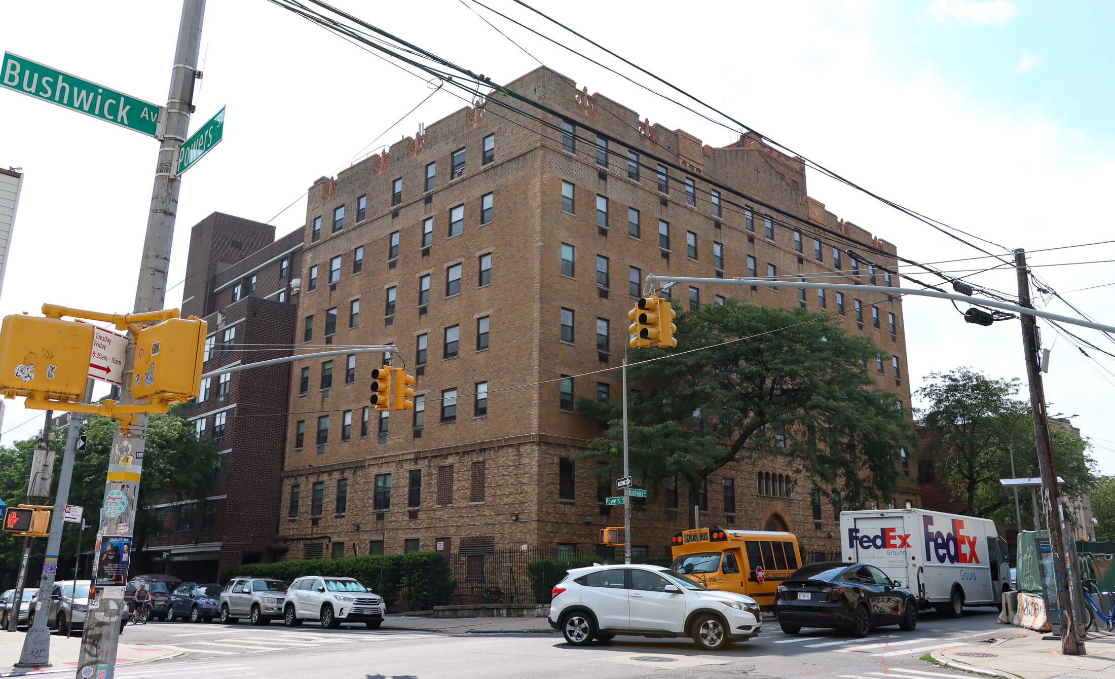 the corner of bushwick and powers showing the 1970s building, 1920s building and the bank