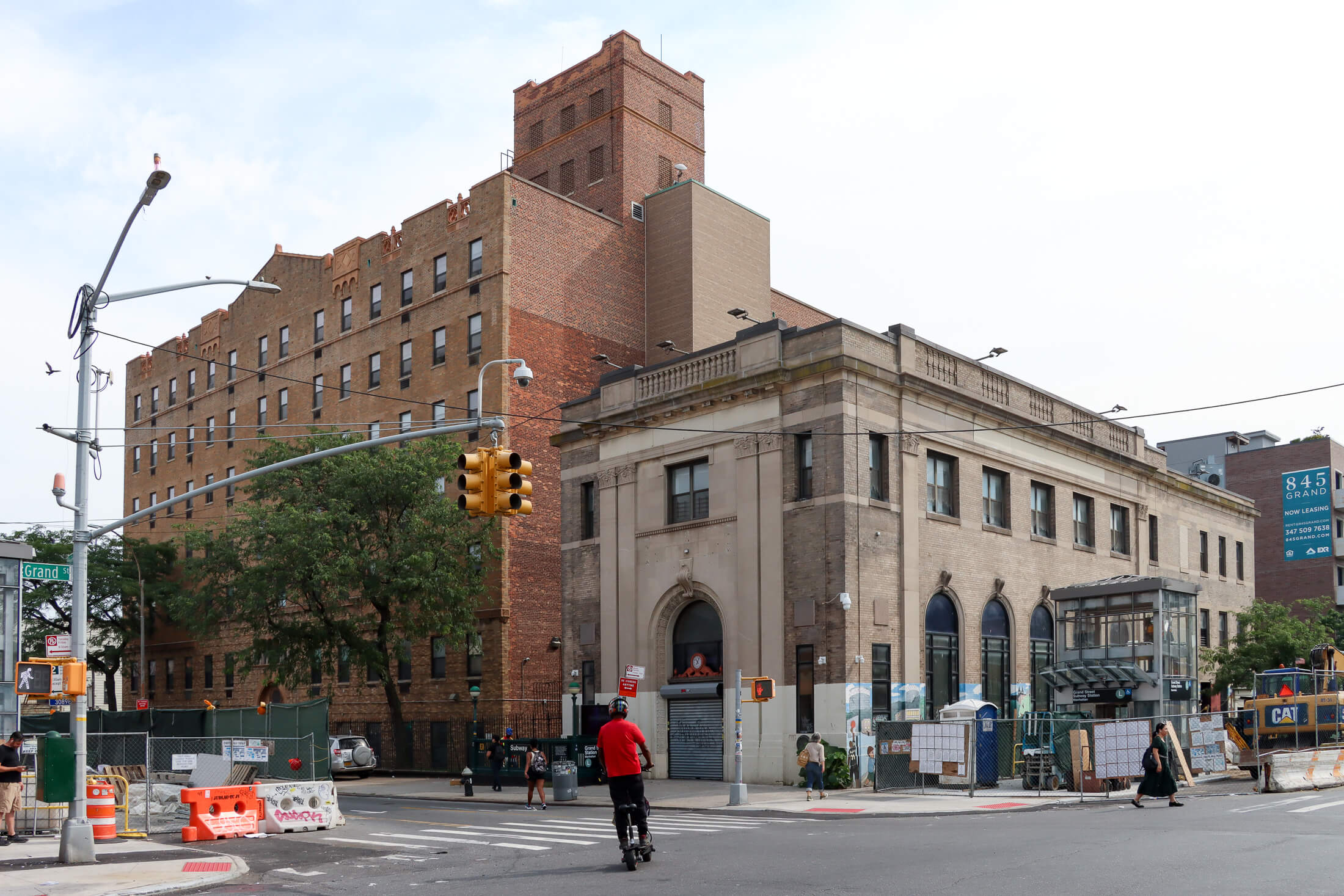 a two story bank building next to St. Nicks brick 1920s building