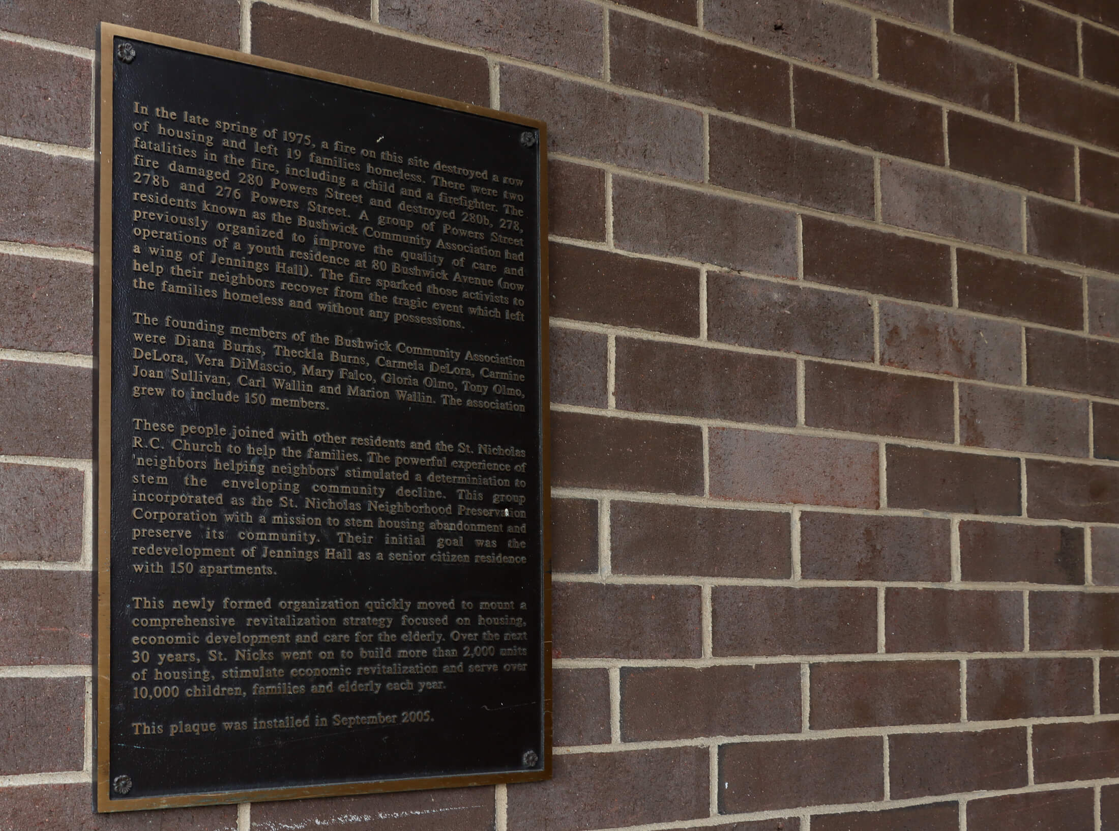 a plaque on jennings hall details the history of the St Nicks