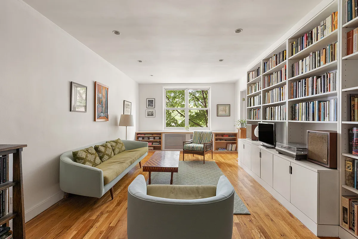 windsor terrace - living room with recessed lighting and wall of bookshelves