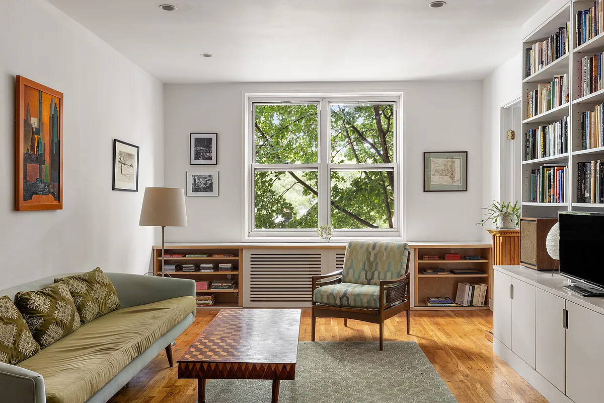 living room with bookshelves under the window