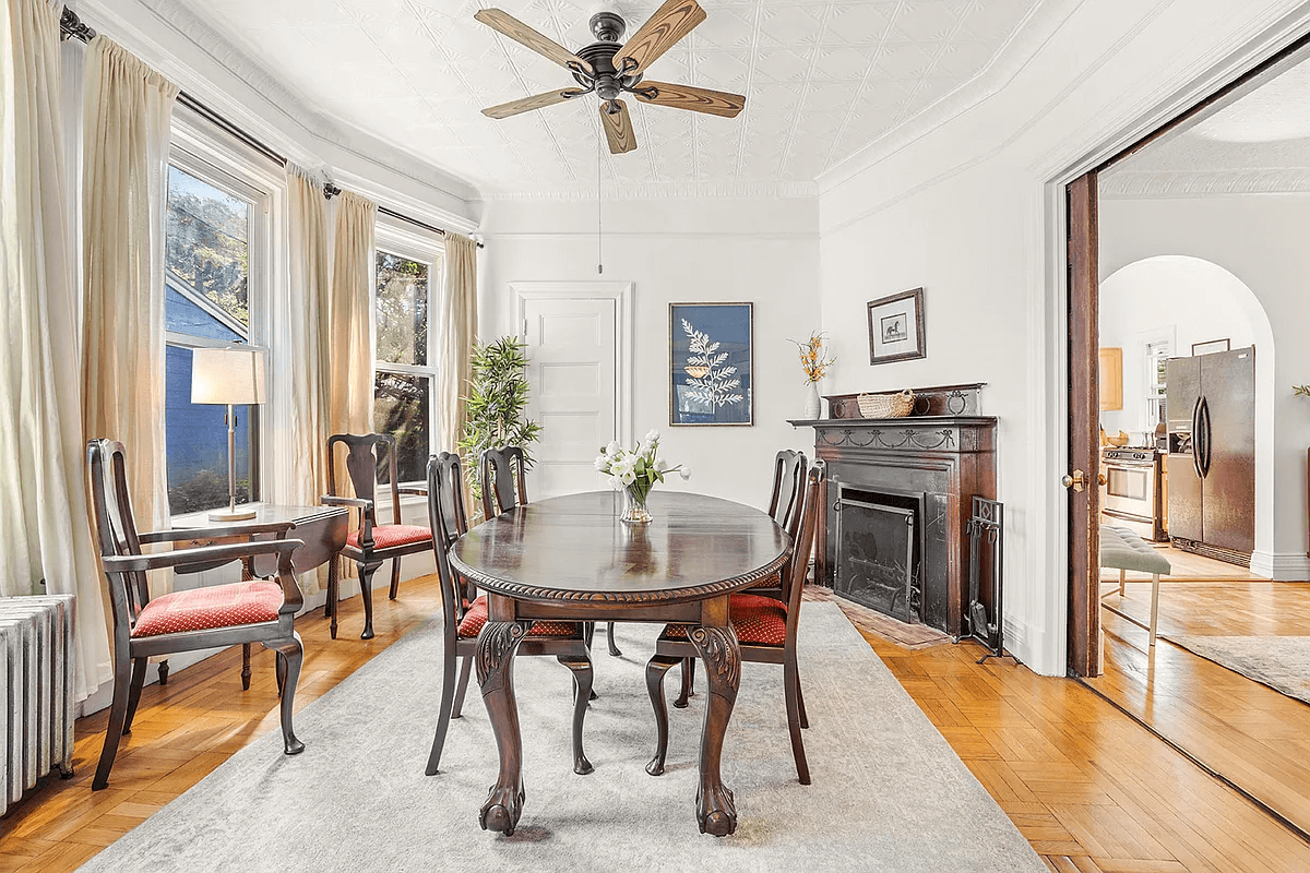 windsor terrace - dining room with wood mantel and tin ceiling