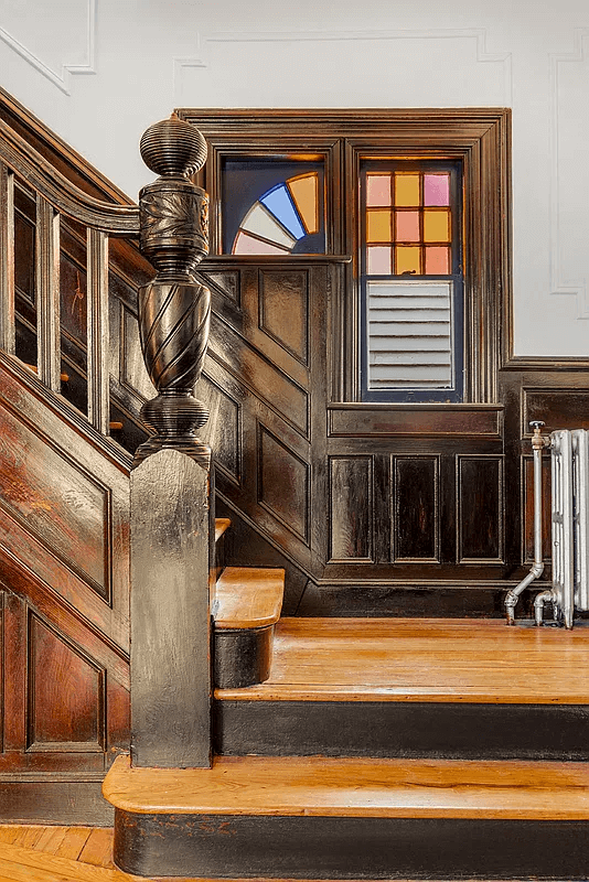 main staircase with stained glass and original stair