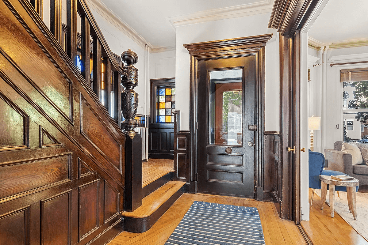 entry with original vestibule door, stained glass and pocket doors to parlor