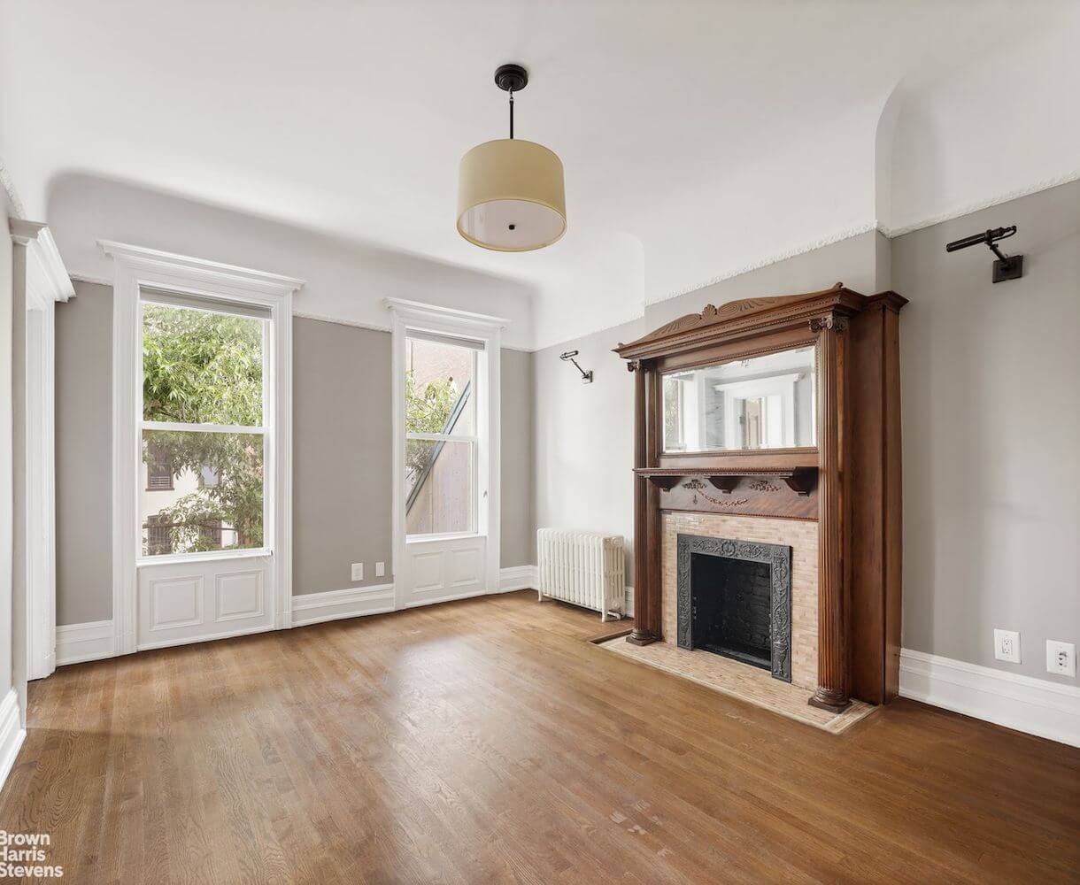 bedroom with mantel and picture rail