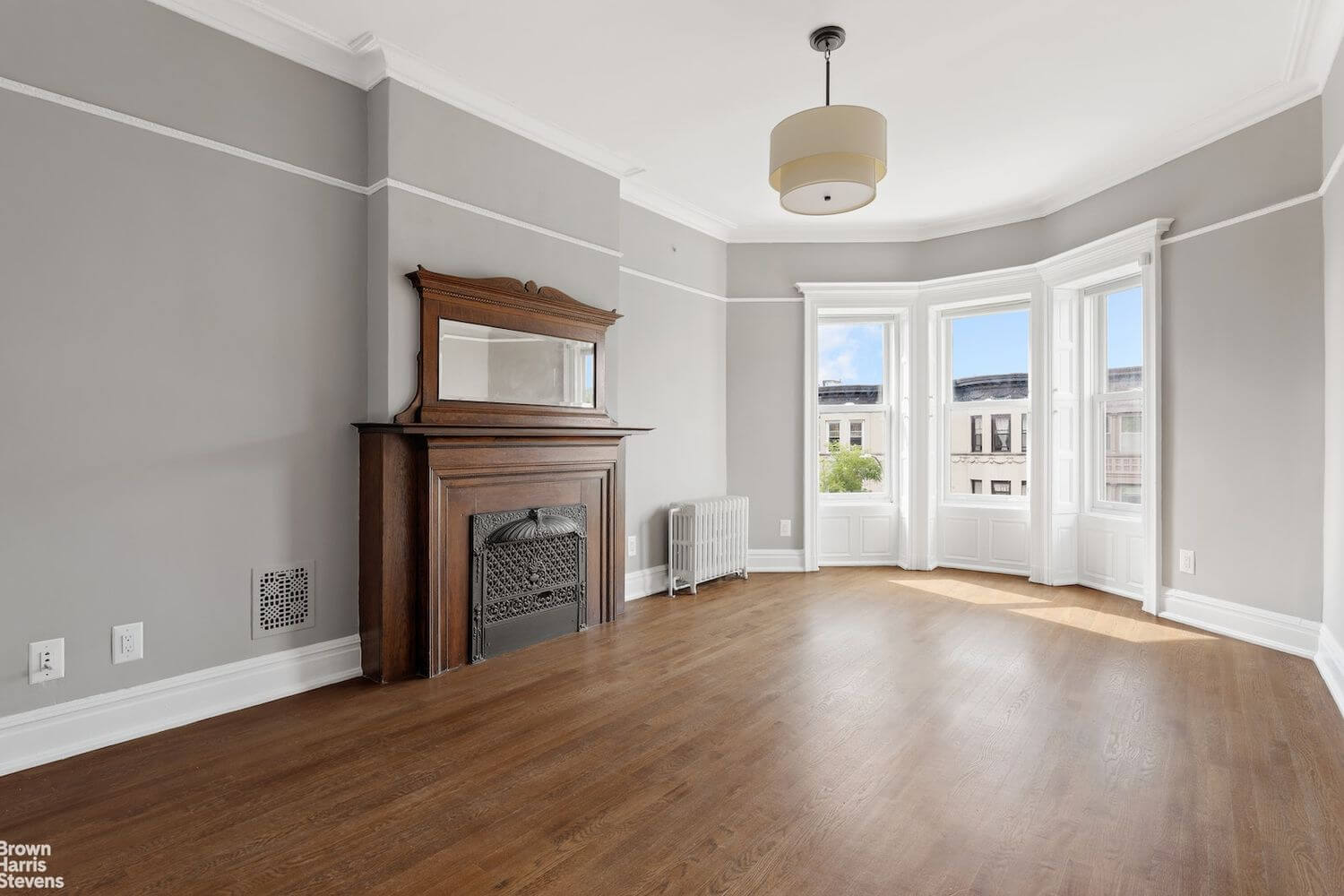 bedroom with wood mantel with insert