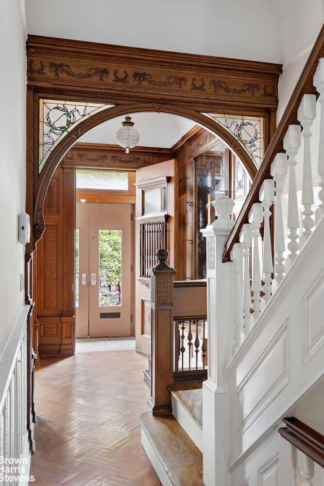 entry with stained glass and original stair