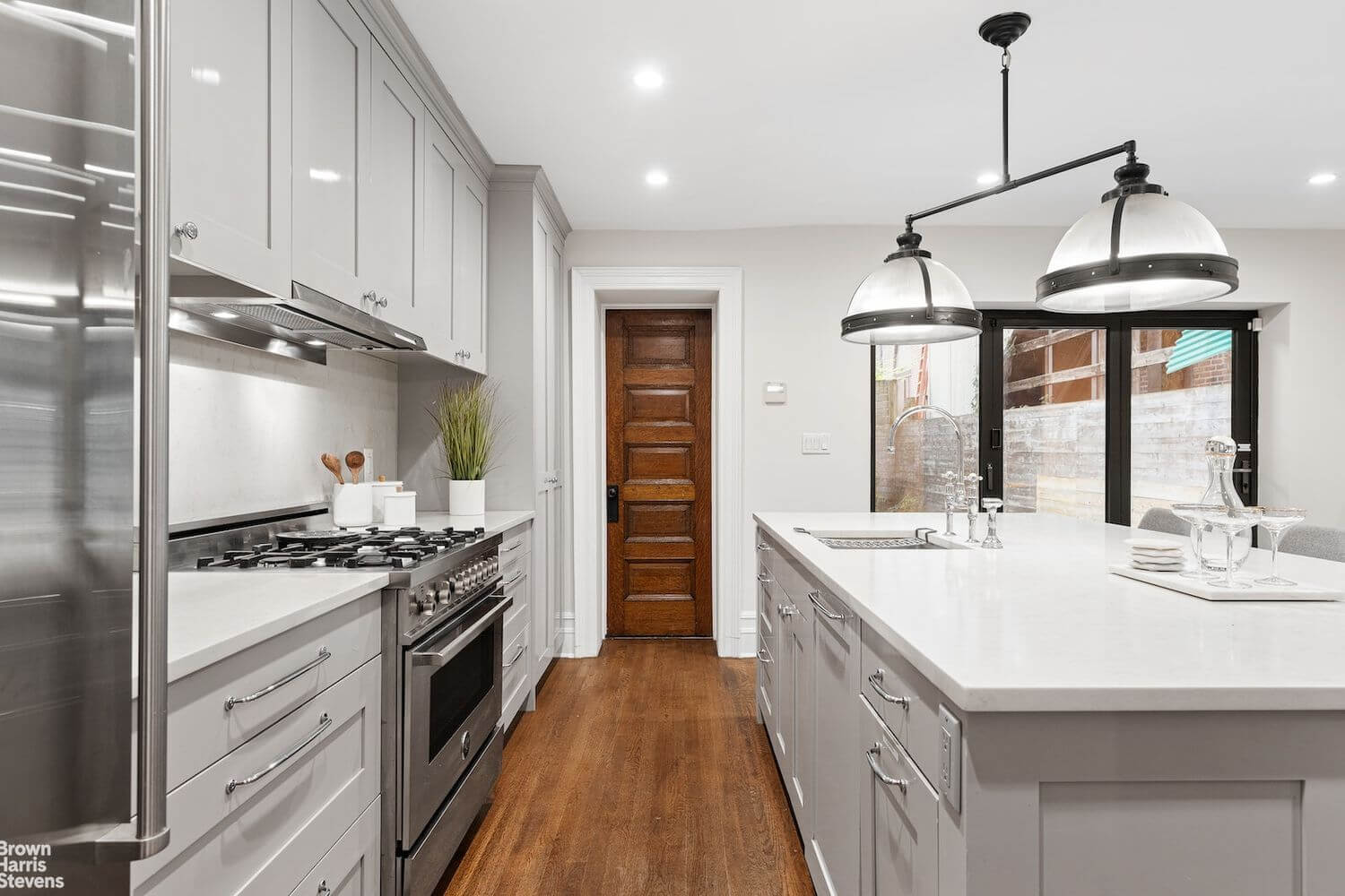 kitchen with gray cabinets and an island