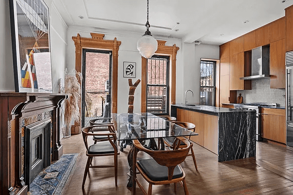 brooklyn open houses - kitchen with an original wood mantel and a marble island