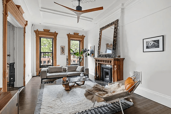 bed stuy parlor with a mantel and moldings