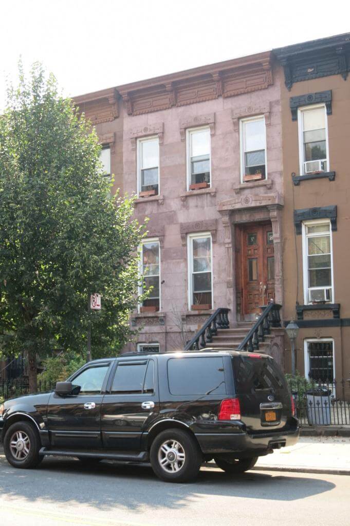 the brownstone exterior of the row house