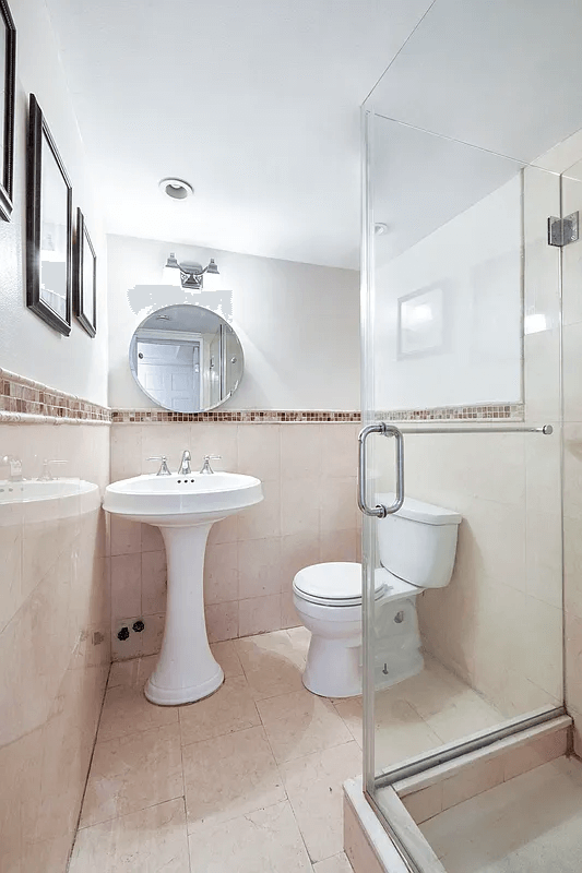 bathroom with a shower with glass doors