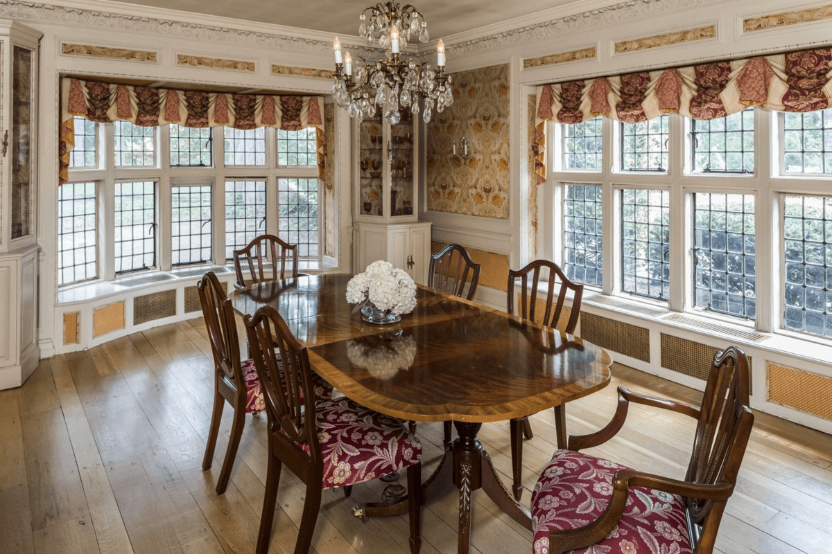 dining room with two walls of windows