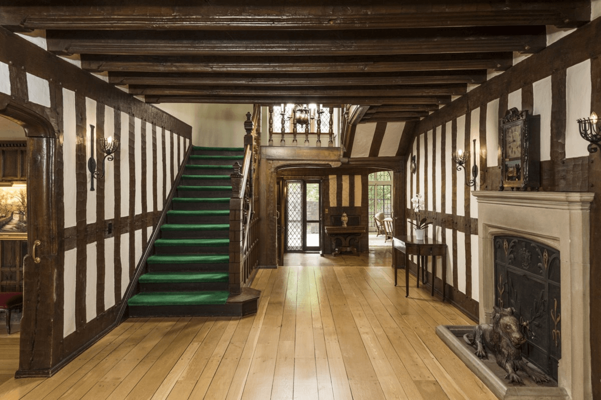 entry hall with timbering and a mantel