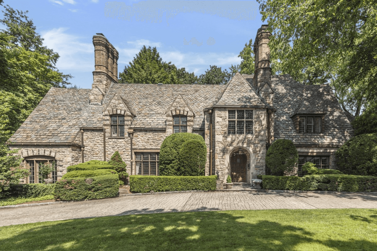 bronxville -exterior of the tudor style stone house with massive chimneys