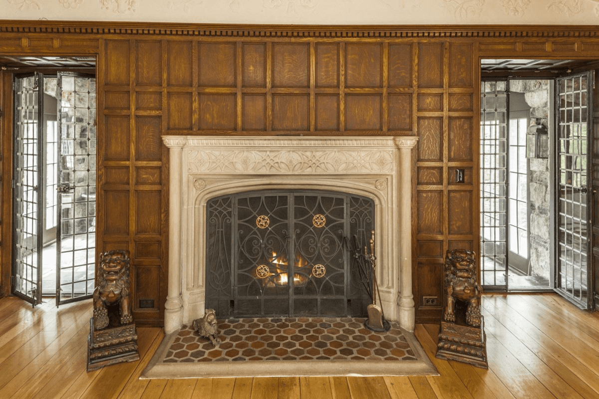 wall of paneling with marble mantel